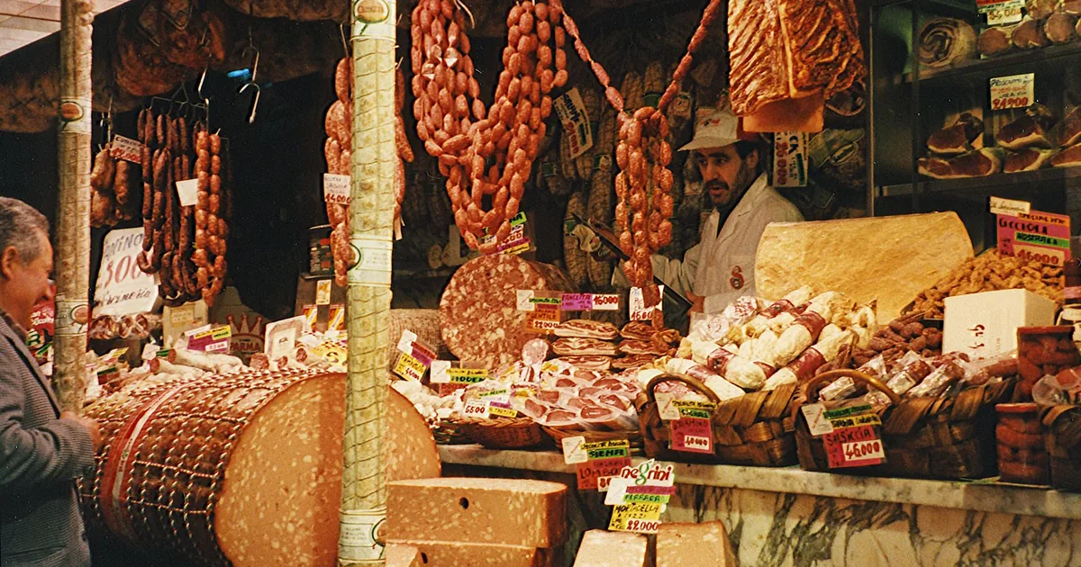 Traditional Italian deli counter in Florence showcasing meats and cheeses.