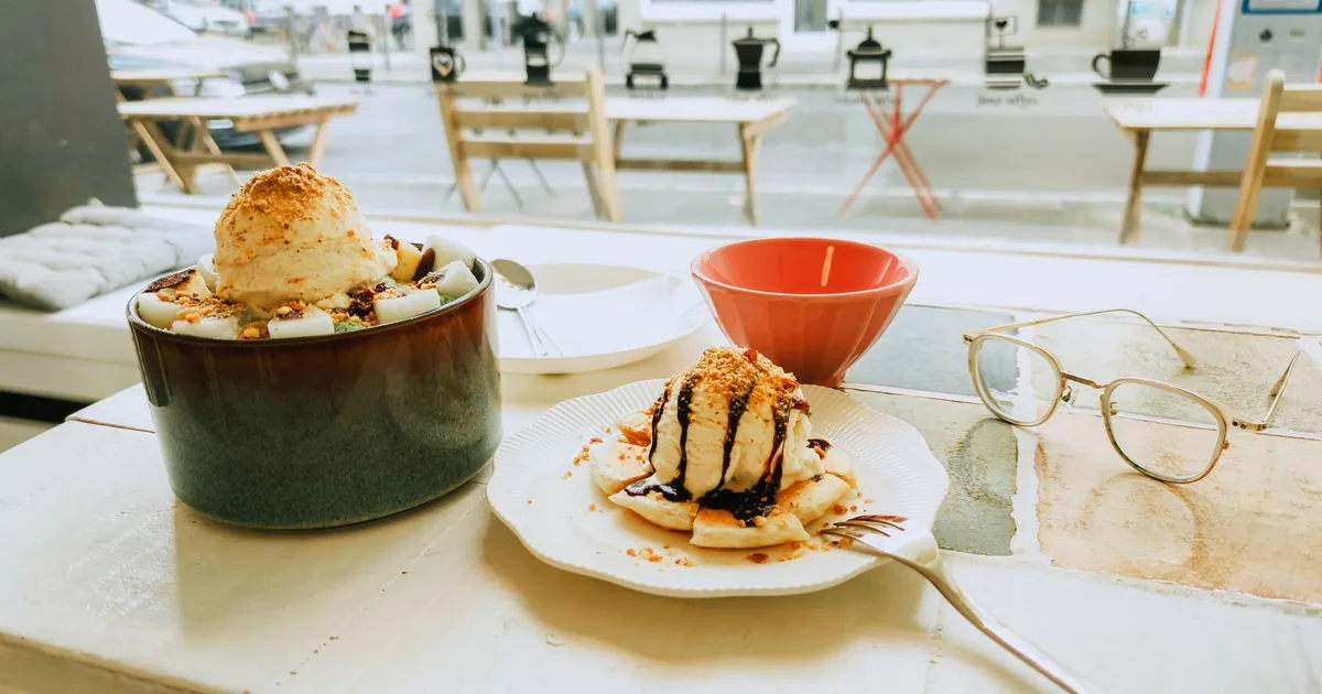 A delightful ice cream dessert served in a cozy cafe setting, perfect for sweet cravings.