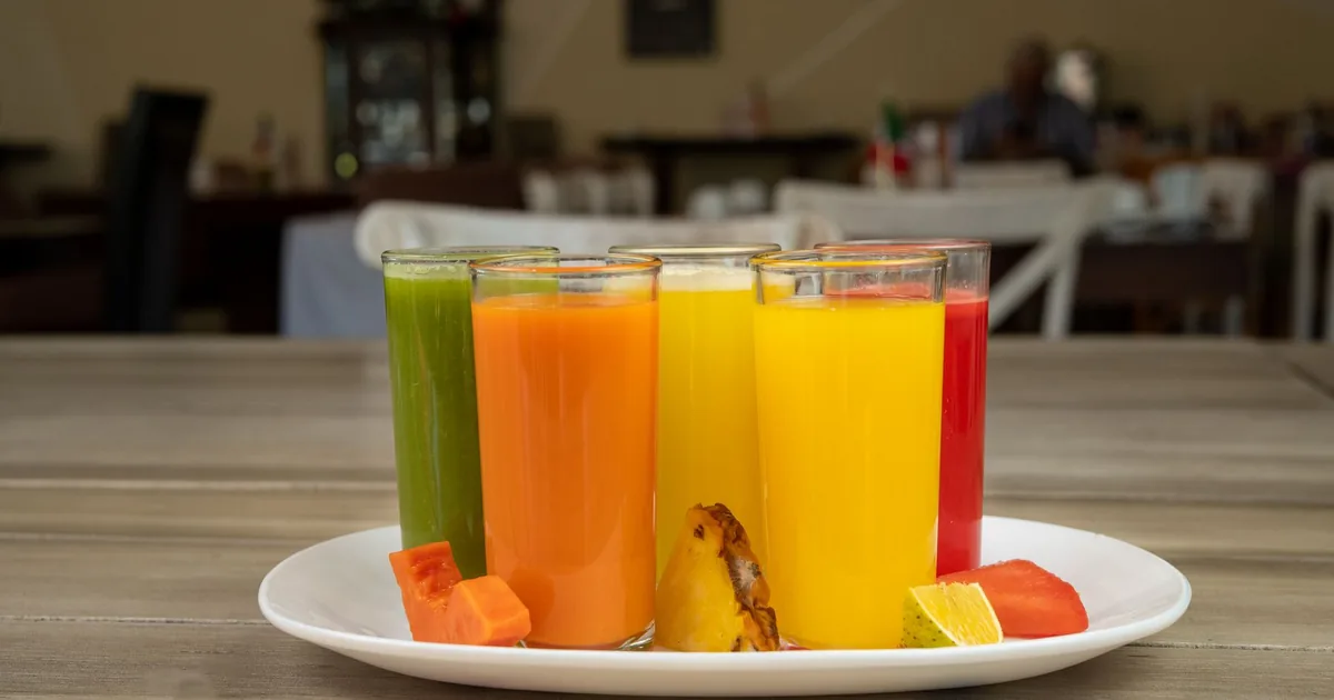 Colorful fruit juices on a wooden table in a Mexican restaurant in Salamanca, Mexico.