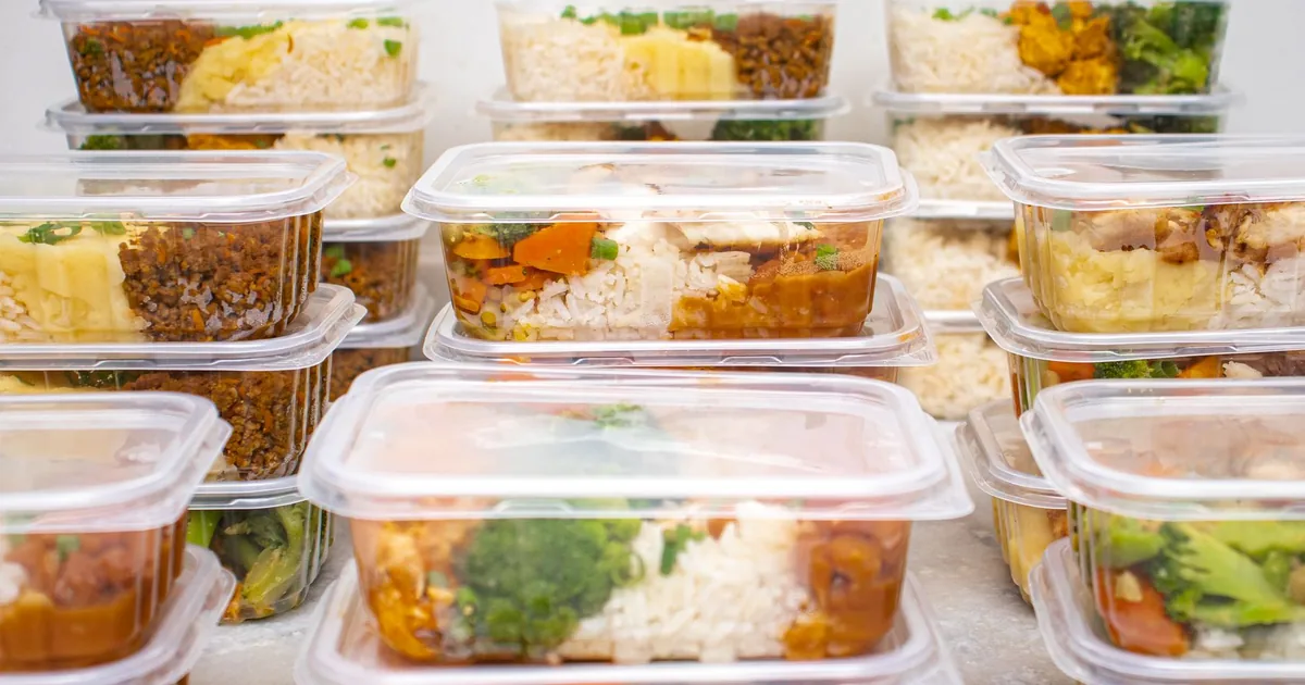 Multiple containers of prepared meals with rice and vegetables for easy meal management.